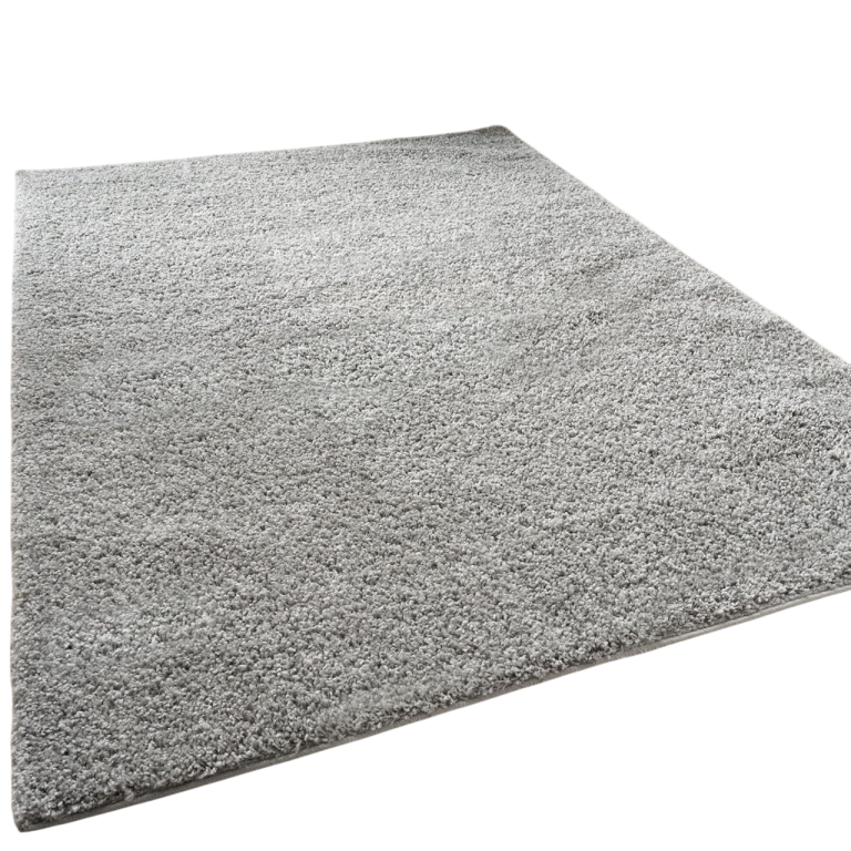 Light grey, plush area rug with a soft texture, rectangular shape. Light grey, plush area rug with a soft texture, rectangular shape.